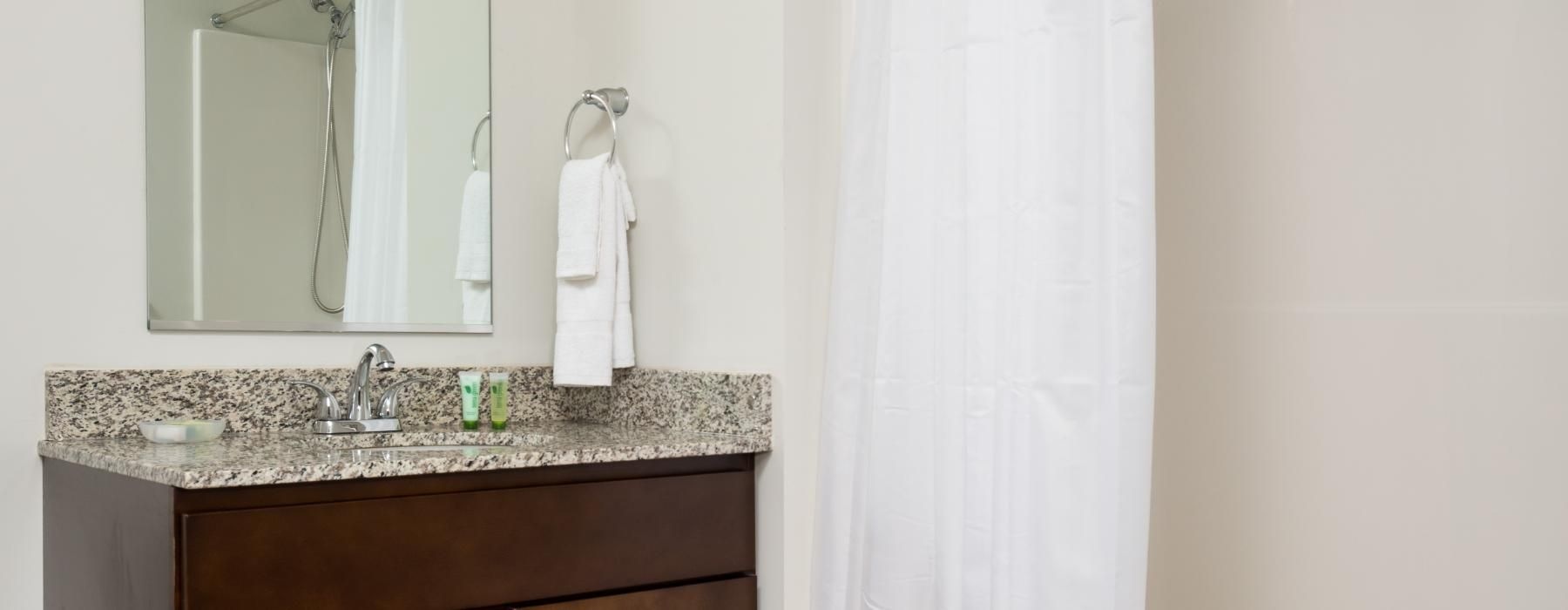 a bathroom with a mirror and a sink