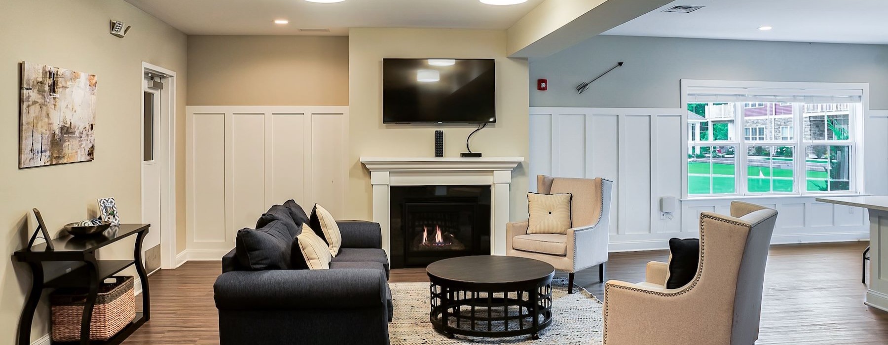 resident lounge area with a tv and seating