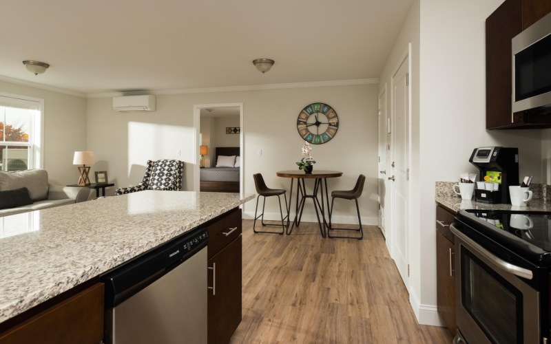 a kitchen with a table and chairs