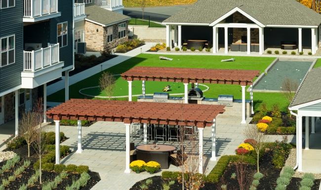 a grill area in the middle of a courtyard